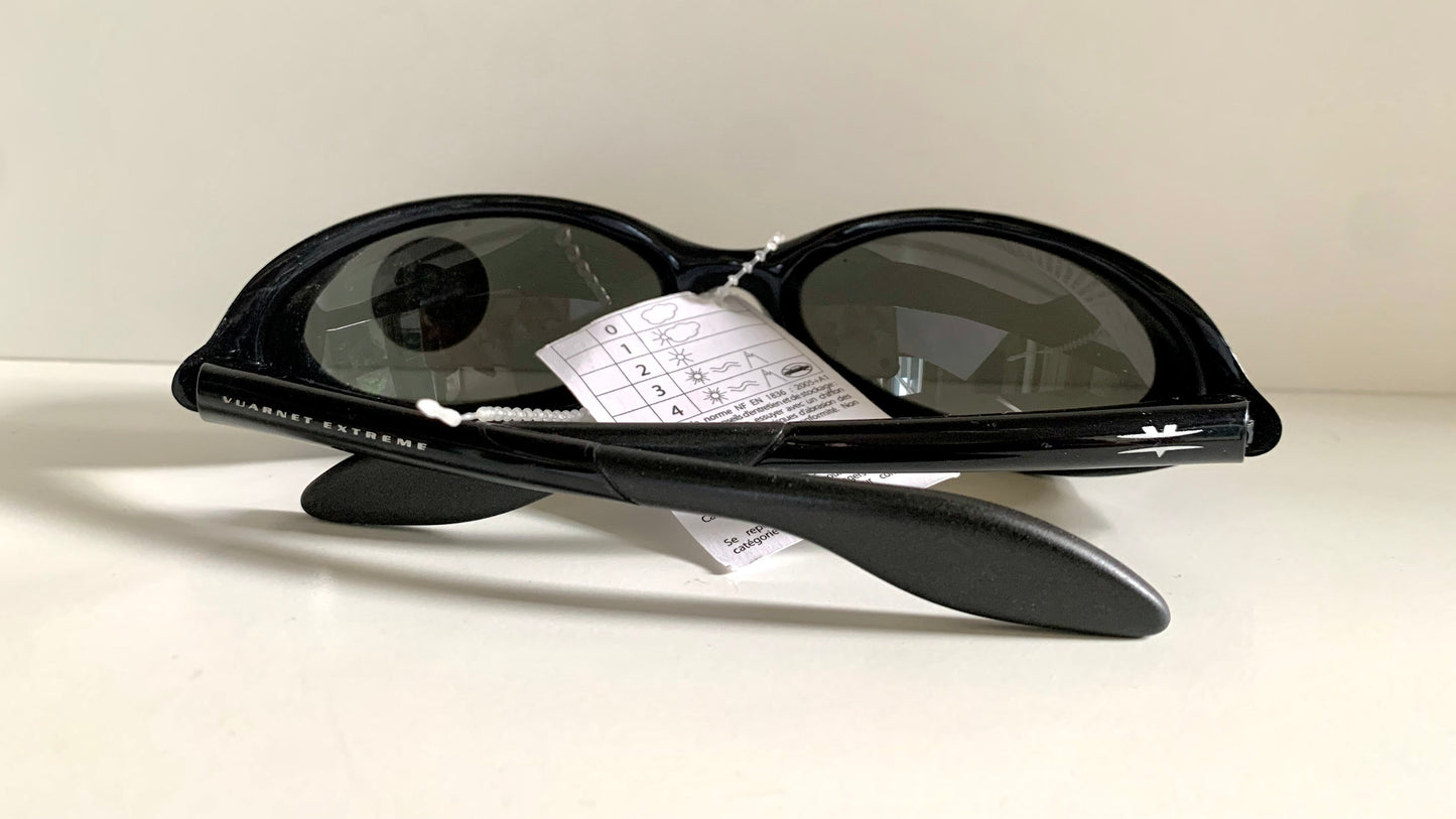 Vuarnet Extreme black sunglasses with a visible brand logo on a white background