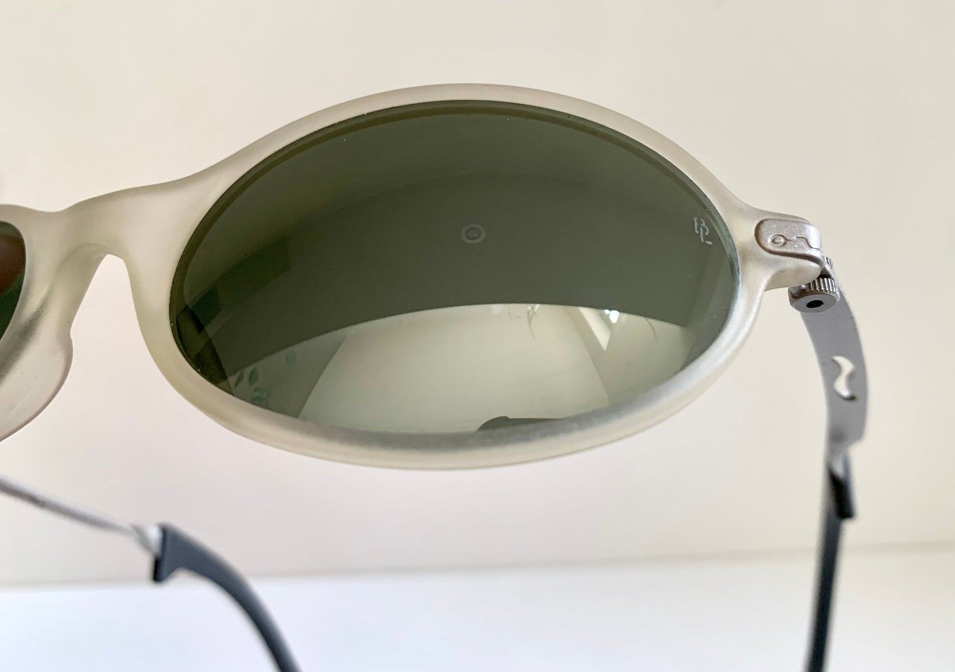 Ray Ban Orbs W2390 clear and silver sunglasses on a white background