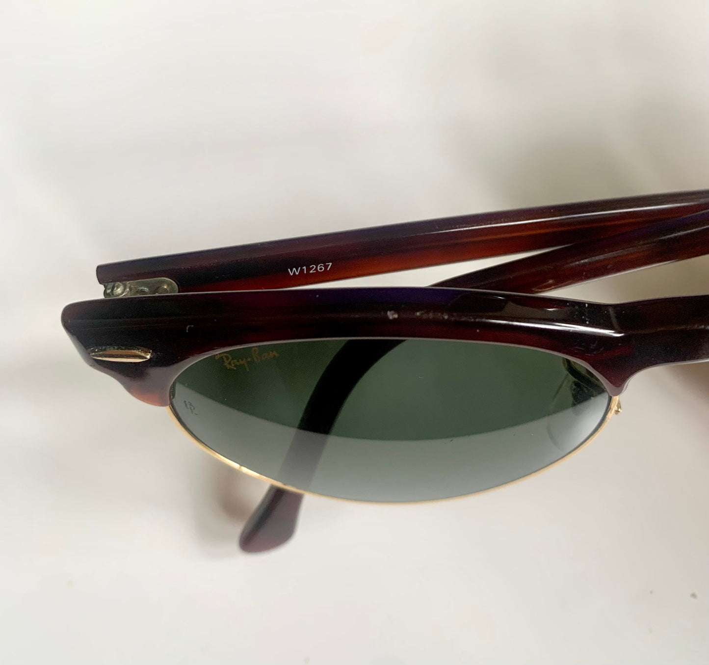 Pair of sunglasses with a 'Ray-Ban' logo on a white background