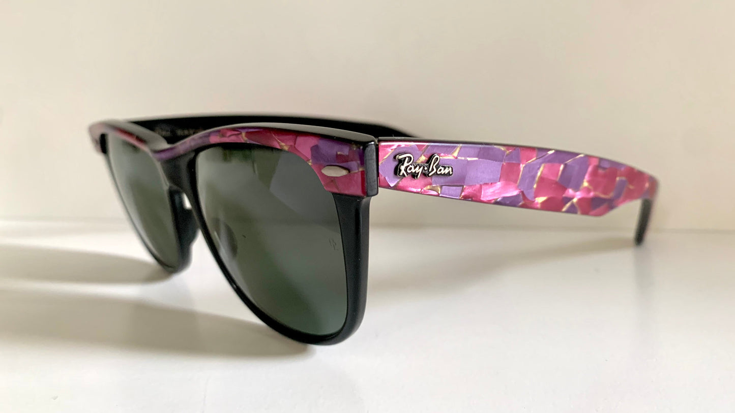 Ray Ban Sreet neat sunglasses with pink mosaice frame on a white surface