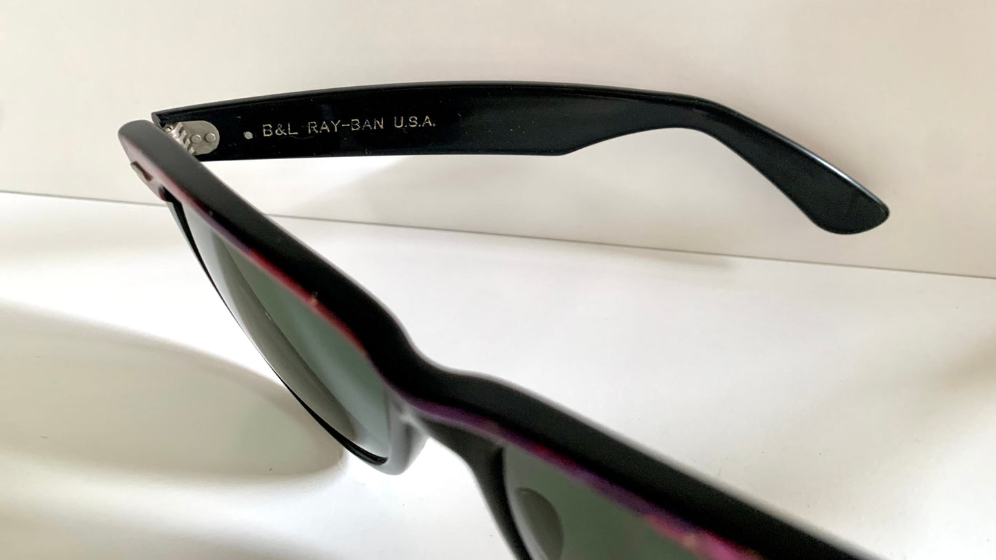 Ray Ban Sreet neat sunglasses with pink mosaice frame on a white surface