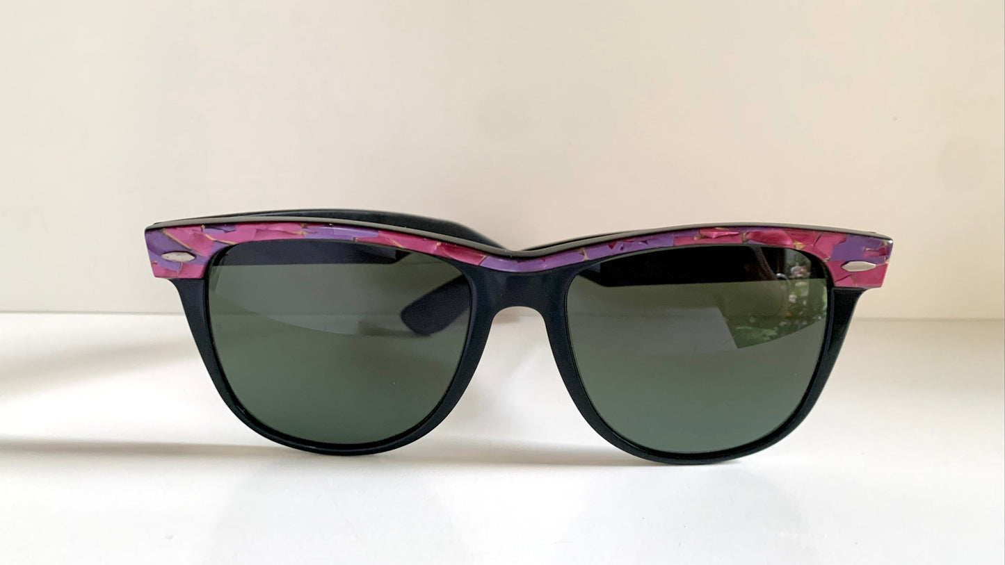 Ray Ban Sreet neat sunglasses with pink mosaice frame on a white surface