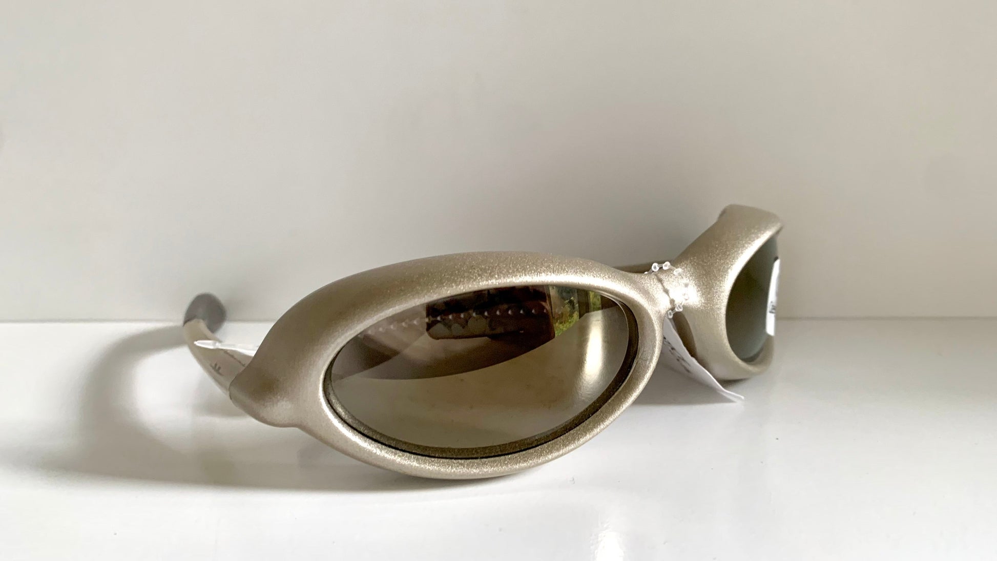 Vuarnet Extreme silver sunglasses with reflective lenses on a white background