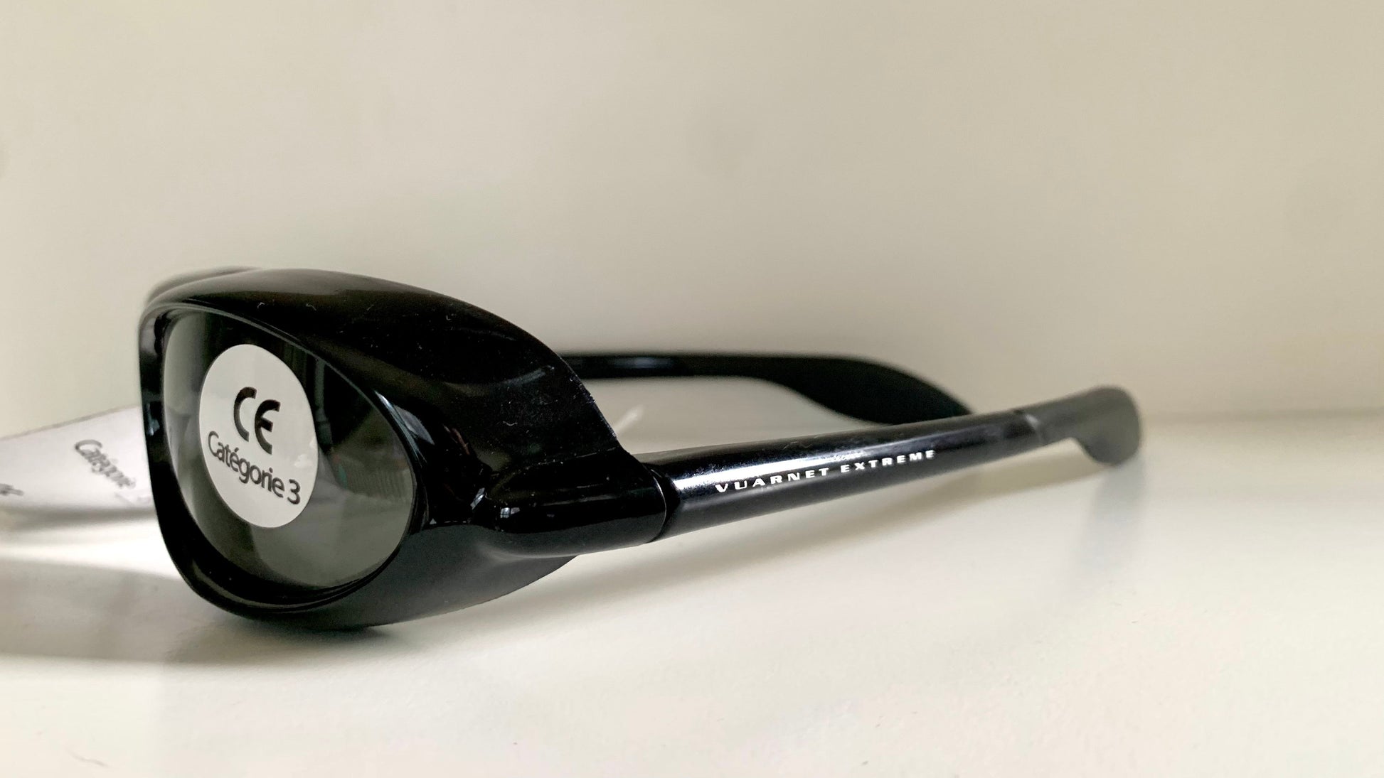 Vuarnet Extreme black sunglasses with a visible brand logo on a white background