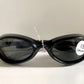 Vuarnet Extreme black sunglasses with a visible brand logo on a white background
