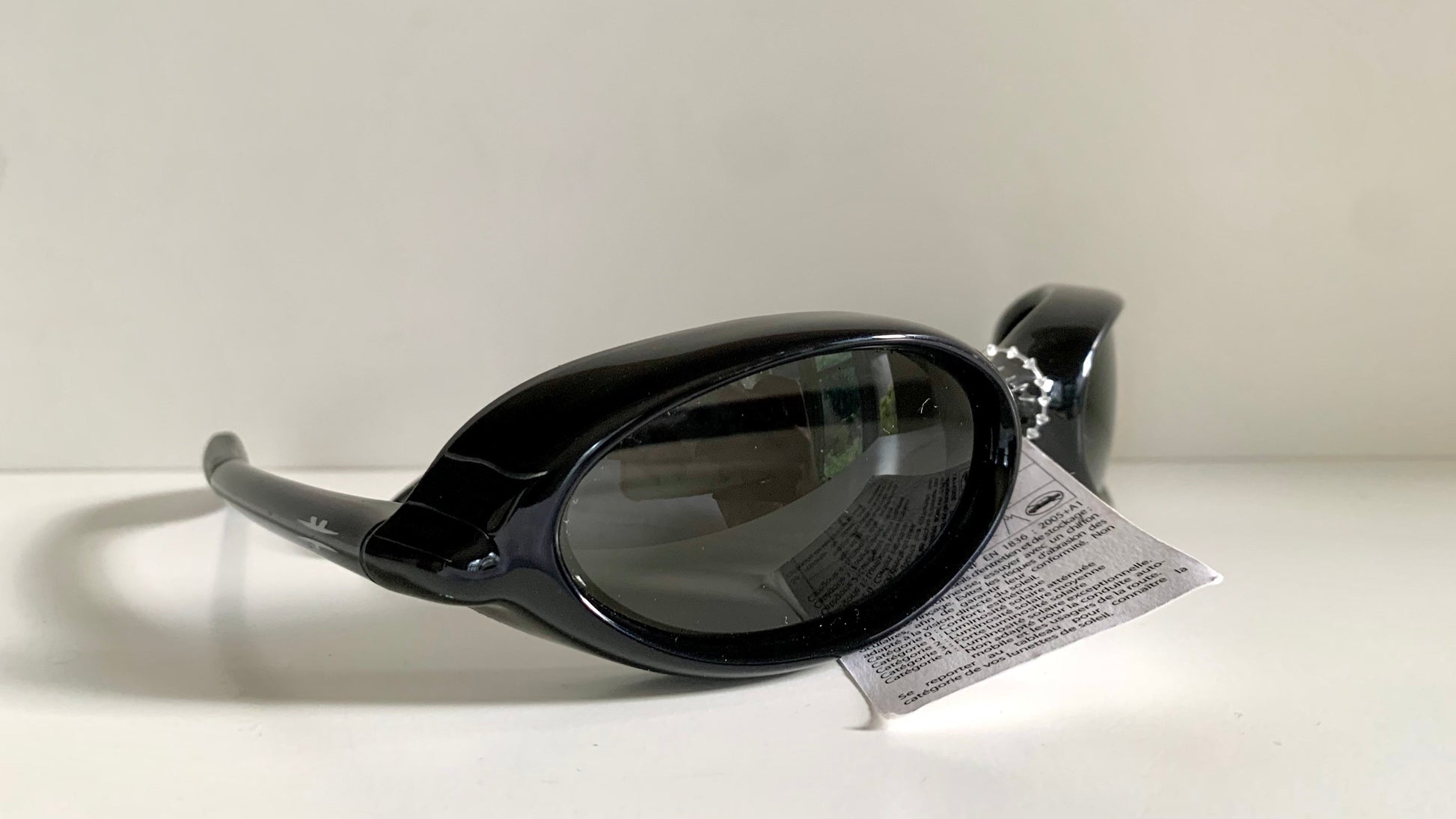 Vuarnet Extreme black sunglasses with a visible brand logo on a white background
