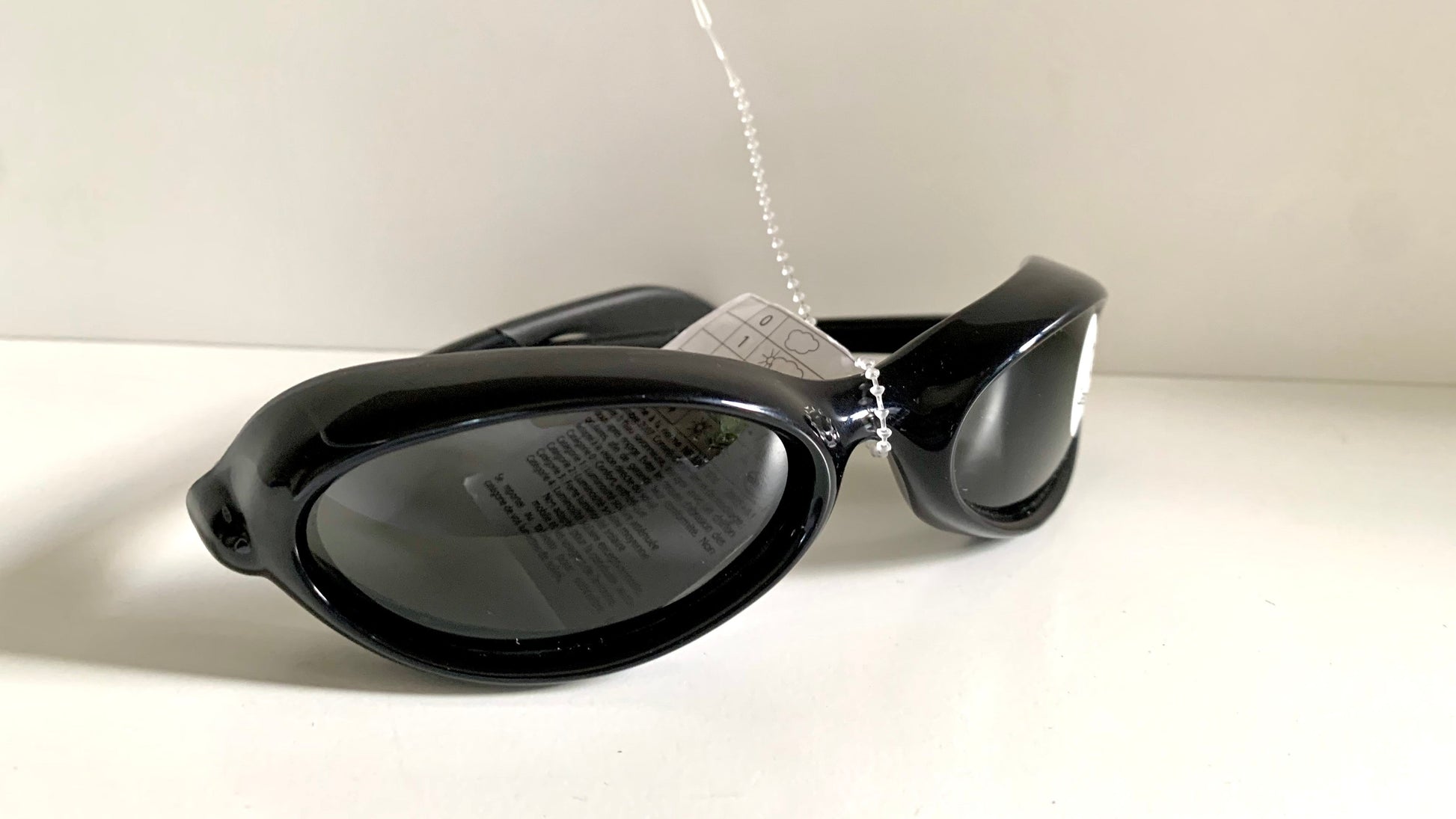 Vuarnet Extreme black sunglasses with a visible brand logo on a white background