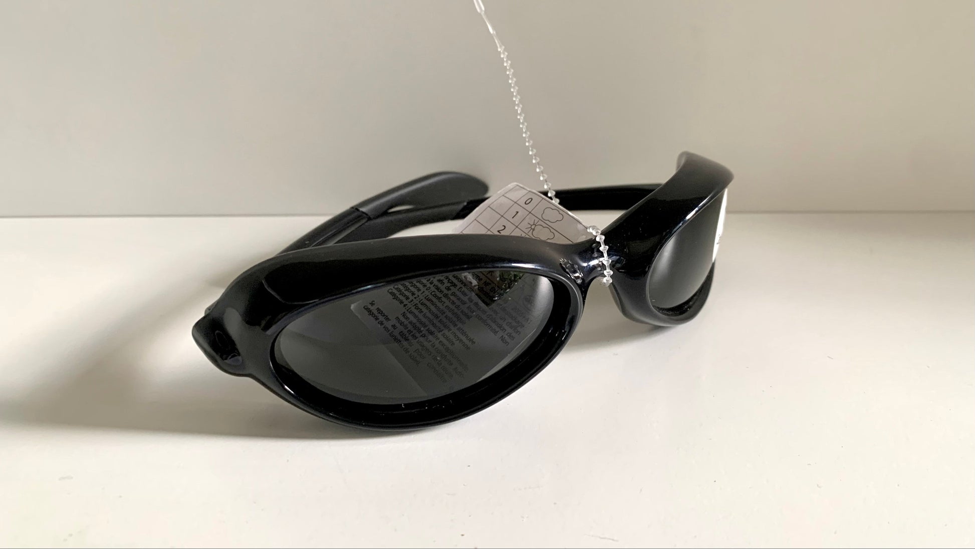 Vuarnet Extreme black sunglasses with a visible brand logo on a white background