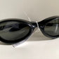 Vuarnet Extreme black sunglasses with a visible brand logo on a white background