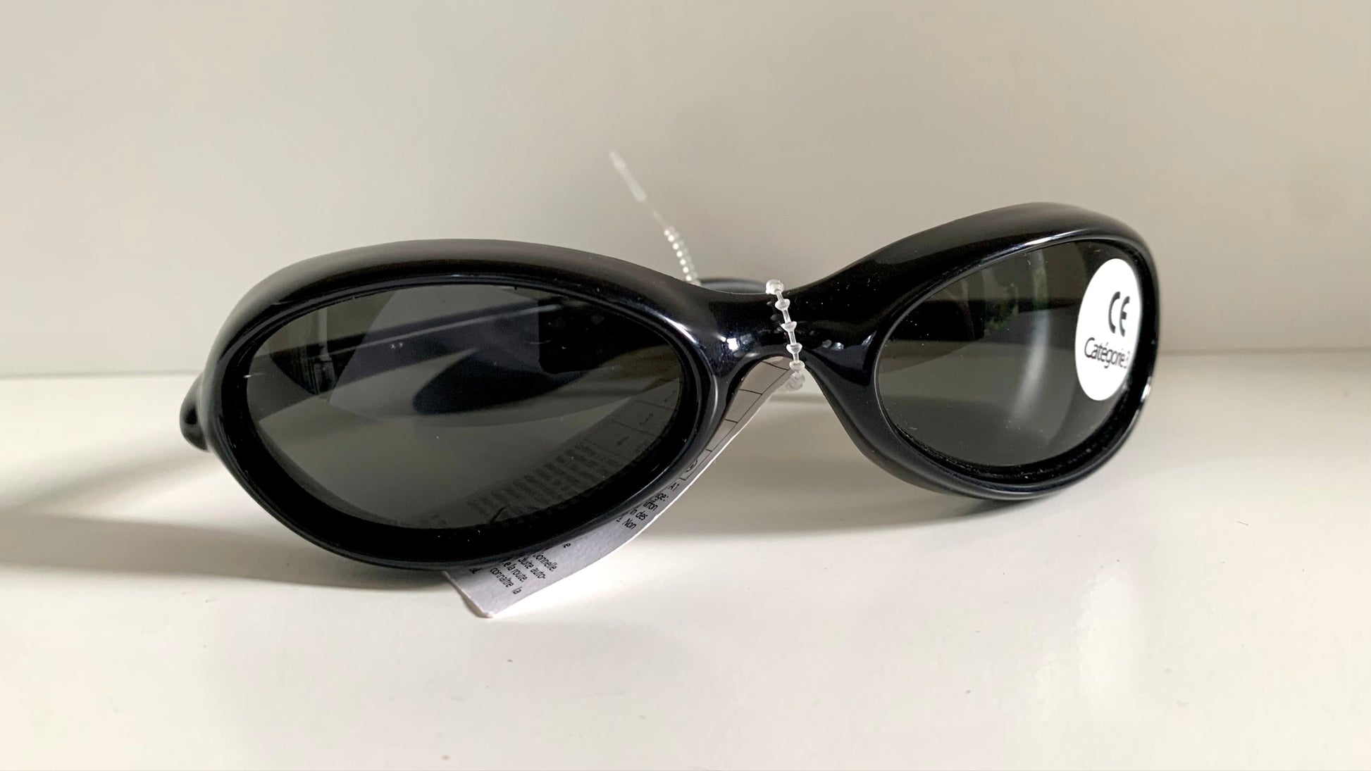 Vuarnet Extreme black sunglasses with a visible brand logo on a white background