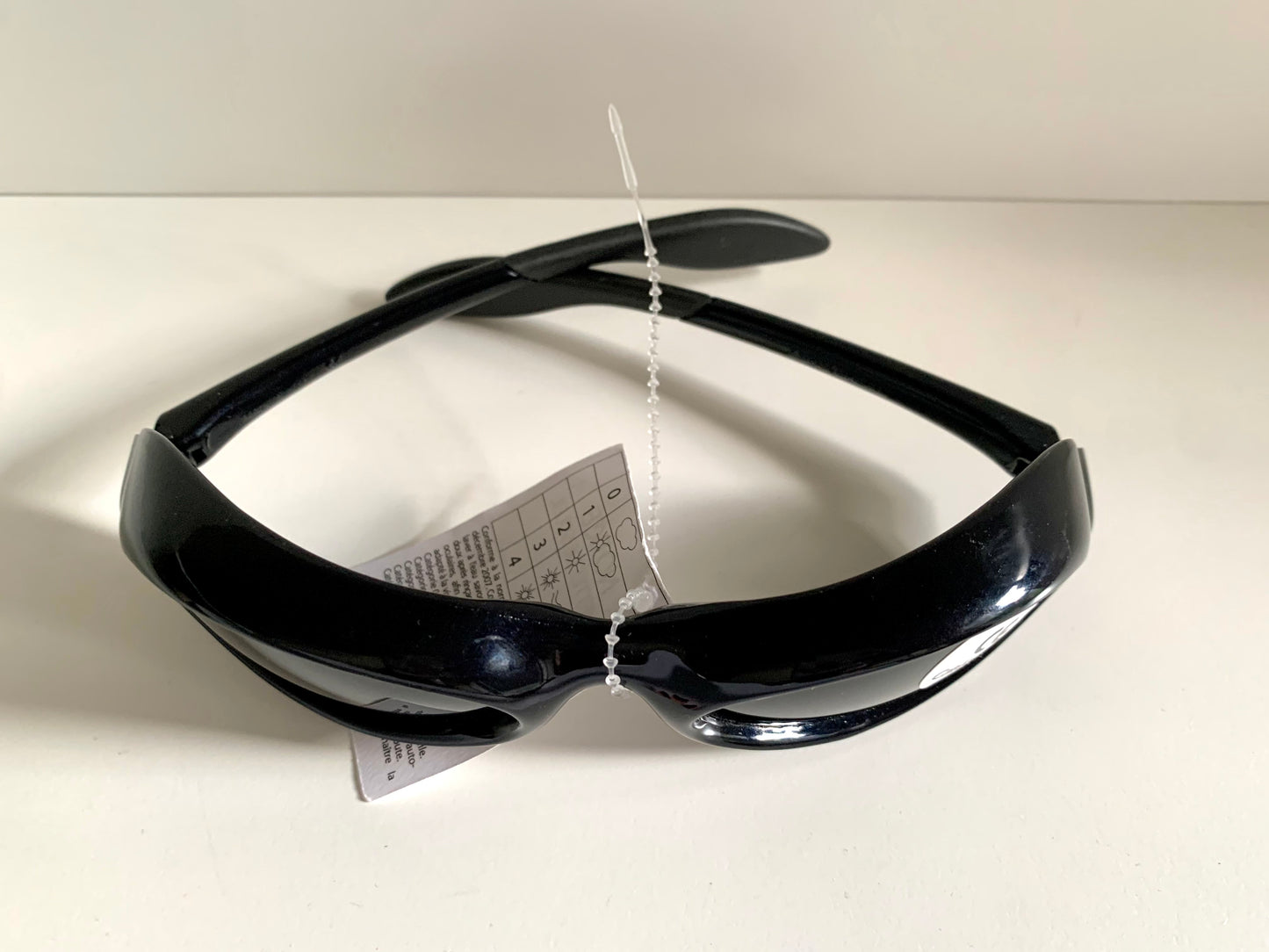 Vuarnet Extreme black sunglasses with a visible brand logo on a white background