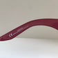Dior sunglasses with a pink frame and dark lenses on a white background