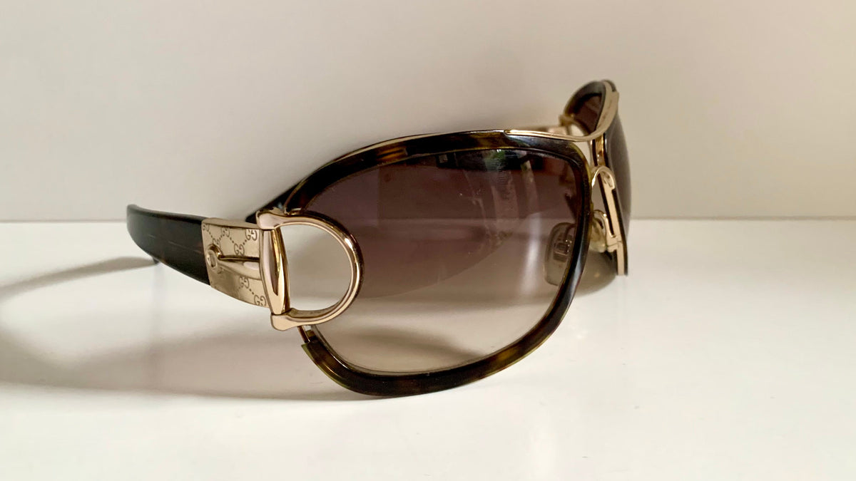 Gucci Vintage-Sonnenbrille aus den 90ern – brauner Wrap-Rahmen mit Strass-Horsebit-Logo