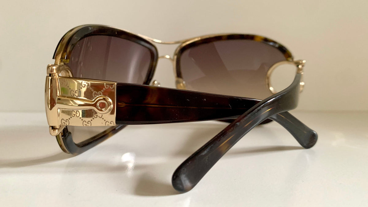 Gucci Vintage-Sonnenbrille aus den 90ern – brauner Wrap-Rahmen mit Strass-Horsebit-Logo