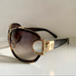 Gucci Vintage-Sonnenbrille aus den 90ern – brauner Wrap-Rahmen mit Strass-Horsebit-Logo
