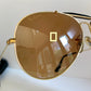 Ray Ban Chromax outdoorsman Gold-framed sunglasses with golden lenses on a white background