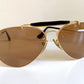 Ray Ban Chromax outdoorsman Gold-framed sunglasses with golden lenses on a white background