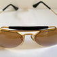 Ray Ban Chromax outdoorsman Gold-framed sunglasses with golden lenses on a white background