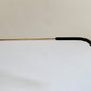 Ray Ban Chromax outdoorsman Gold-framed sunglasses with golden lenses on a white background