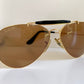 Ray Ban Chromax outdoorsman Gold-framed sunglasses with golden lenses on a white background