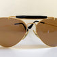 Ray Ban Chromax outdoorsman Gold-framed sunglasses with golden lenses on a white background