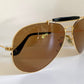 Ray Ban Chromax outdoorsman Gold-framed sunglasses with golden lenses on a white background