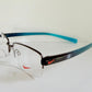 Vintage Nike 00s eyeglasses - Y2K rimless frame with black and blue temple