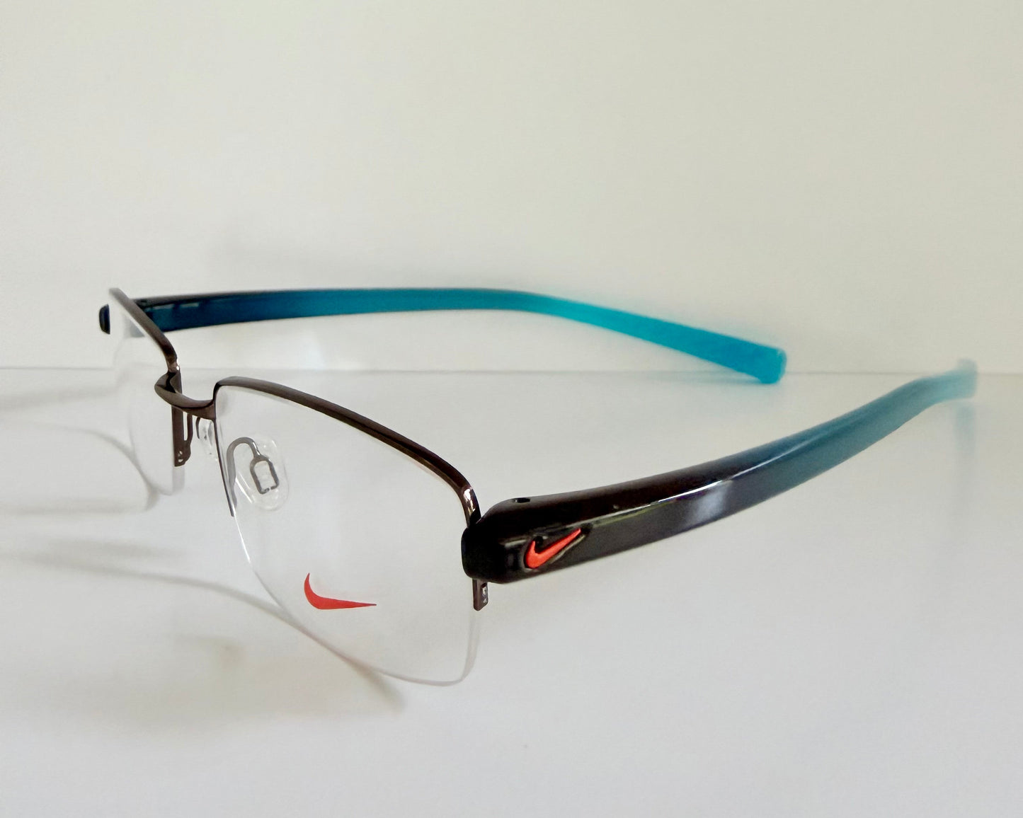 Vintage Nike 00s eyeglasses - Y2K rimless frame with black and blue temple