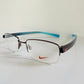 Vintage Nike 00s eyeglasses - Y2K rimless frame with black and blue temple
