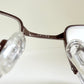Vintage Nike 00s eyeglasses - Y2K rimless frame with black and blue temple