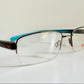 Vintage Nike 00s eyeglasses - Y2K rimless frame with black and blue temple