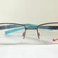 Vintage Nike 00s eyeglasses - Y2K rimless frame with black and blue temple