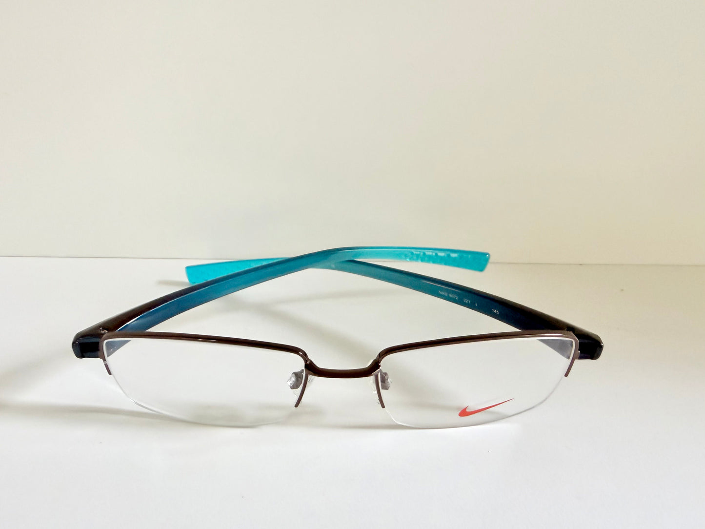 Vintage Nike 00s eyeglasses - Y2K rimless frame with black and blue temple