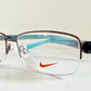 Vintage Nike 00s eyeglasses - Y2K rimless frame with black and blue temple