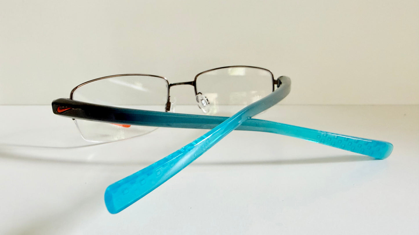 Vintage Nike 00s eyeglasses - Y2K rimless frame with black and blue temple