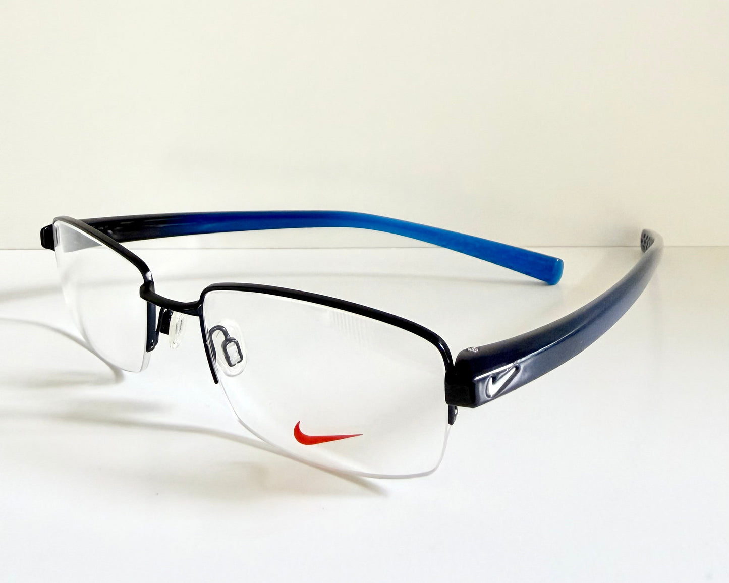 Vintage Nike 00s eyeglasses - Y2K rimless frame with black and blue temple