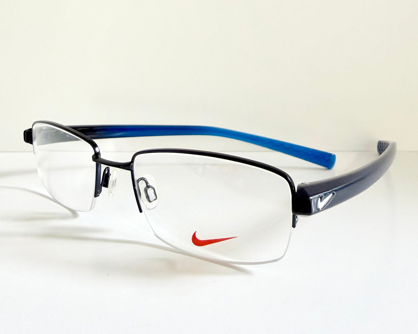 Vintage Nike 00s eyeglasses - Y2K rimless frame with black and blue temple