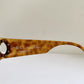 Brown sunglasses with Christian Dior branding on a white background