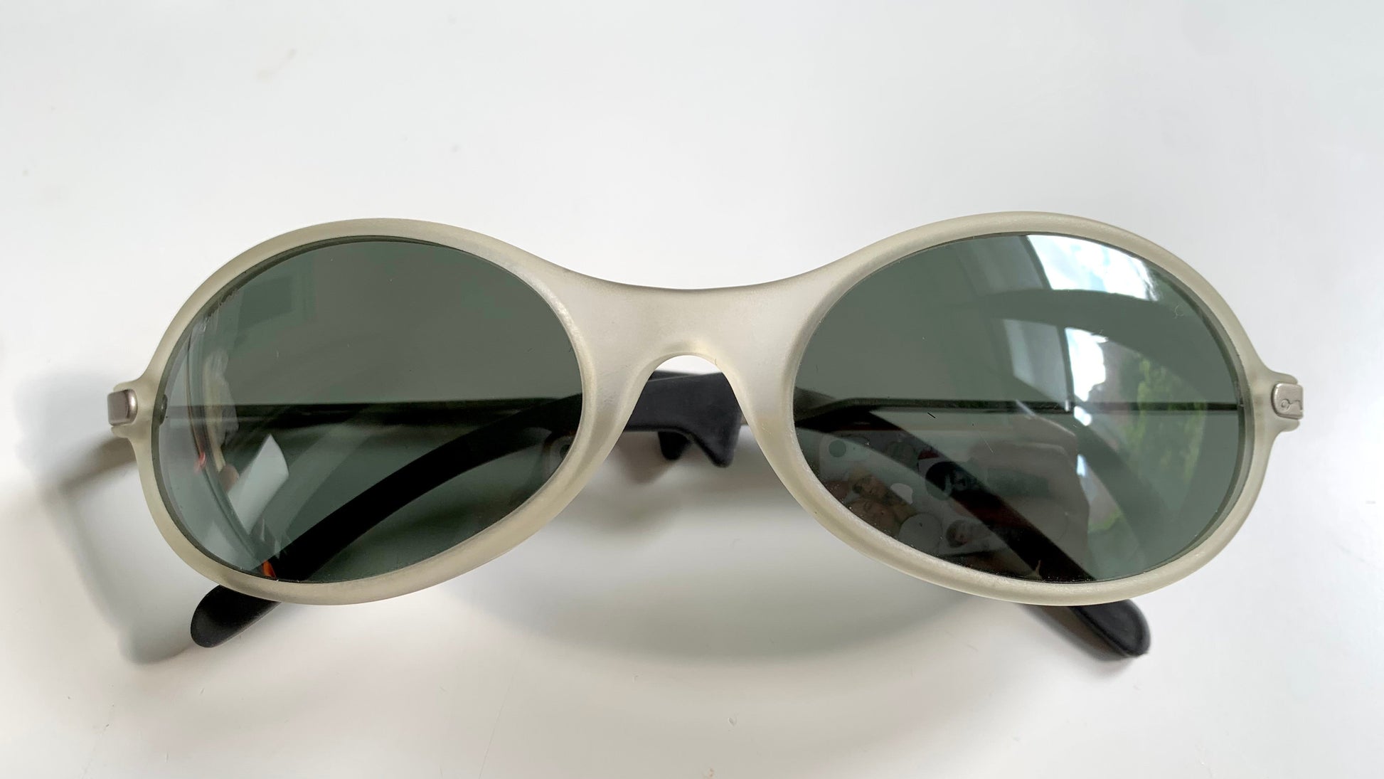 Ray Ban Orbs W2390 clear and silver sunglasses on a white background