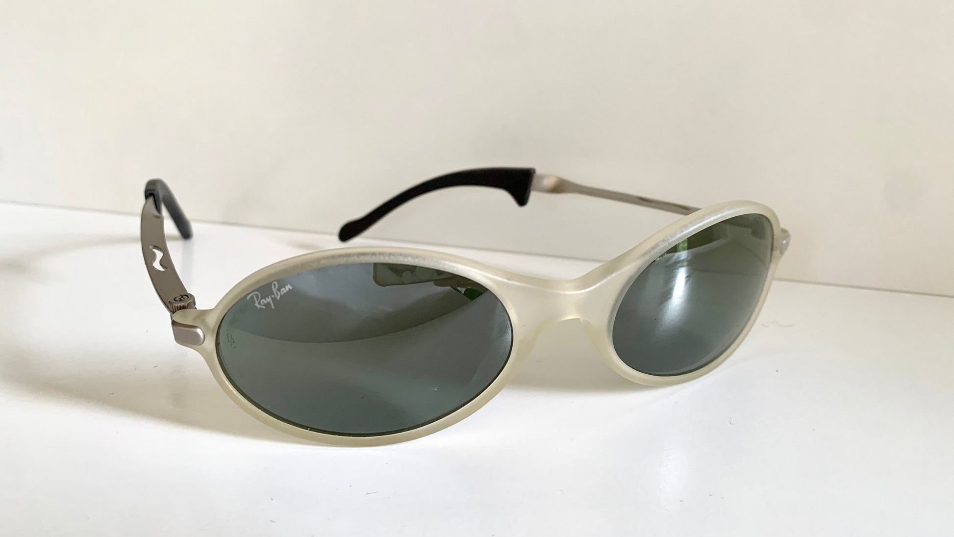Ray Ban Orbs W2390 clear and silver sunglasses on a white background