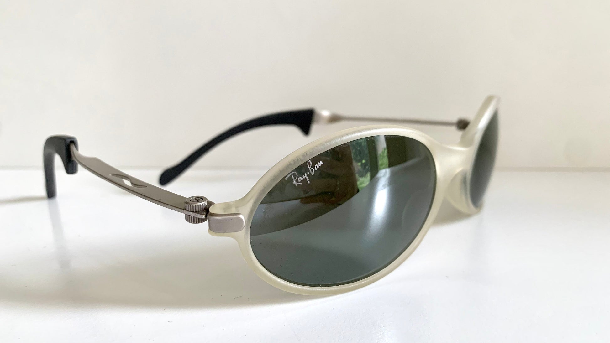 Ray Ban Orbs W2390 clear and silver sunglasses on a white background