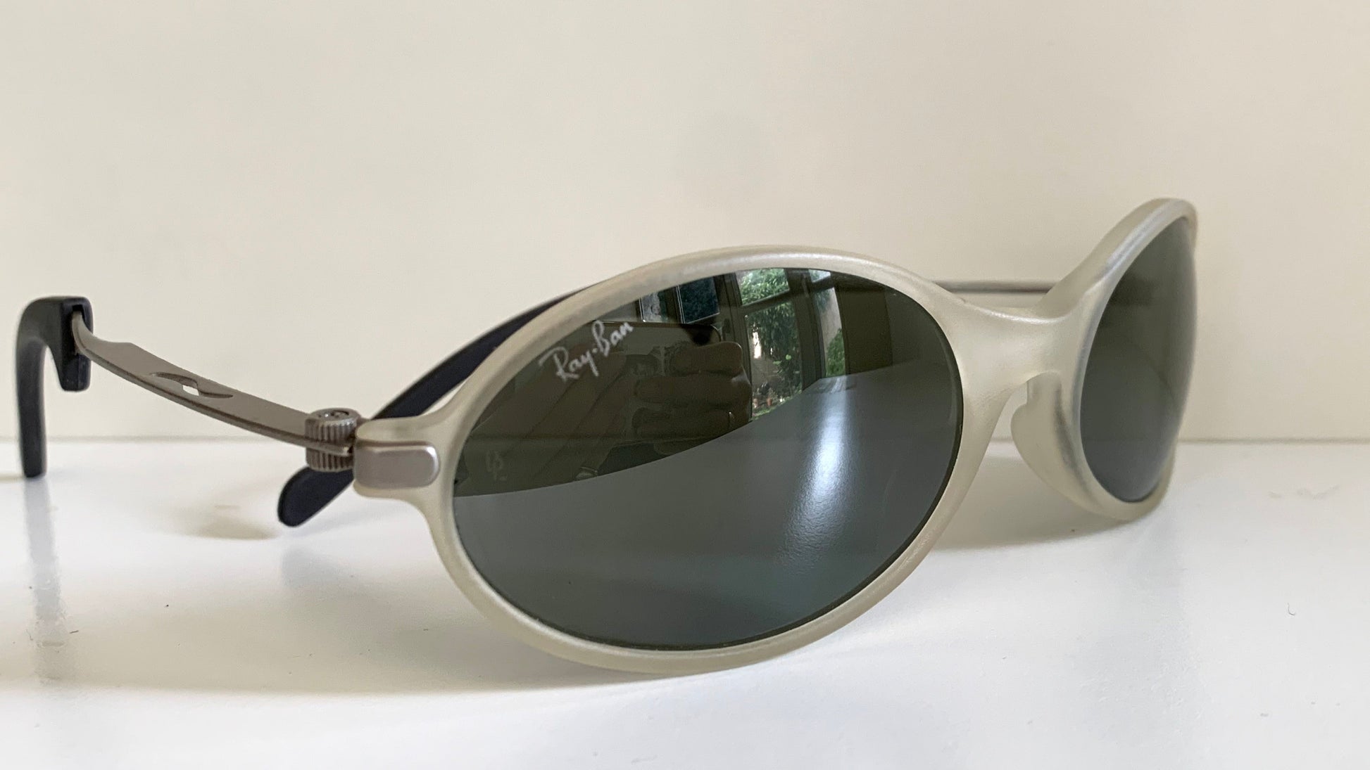 Ray Ban Orbs W2390 clear and silver sunglasses on a white background