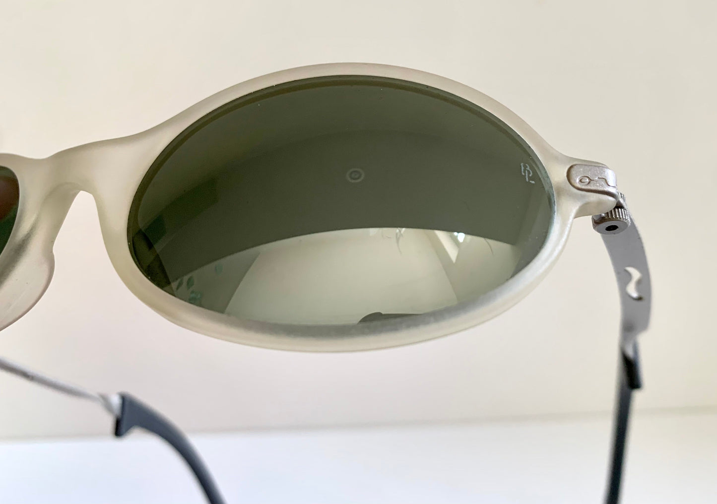 Ray Ban Orbs W2390 clear and silver sunglasses on a white background