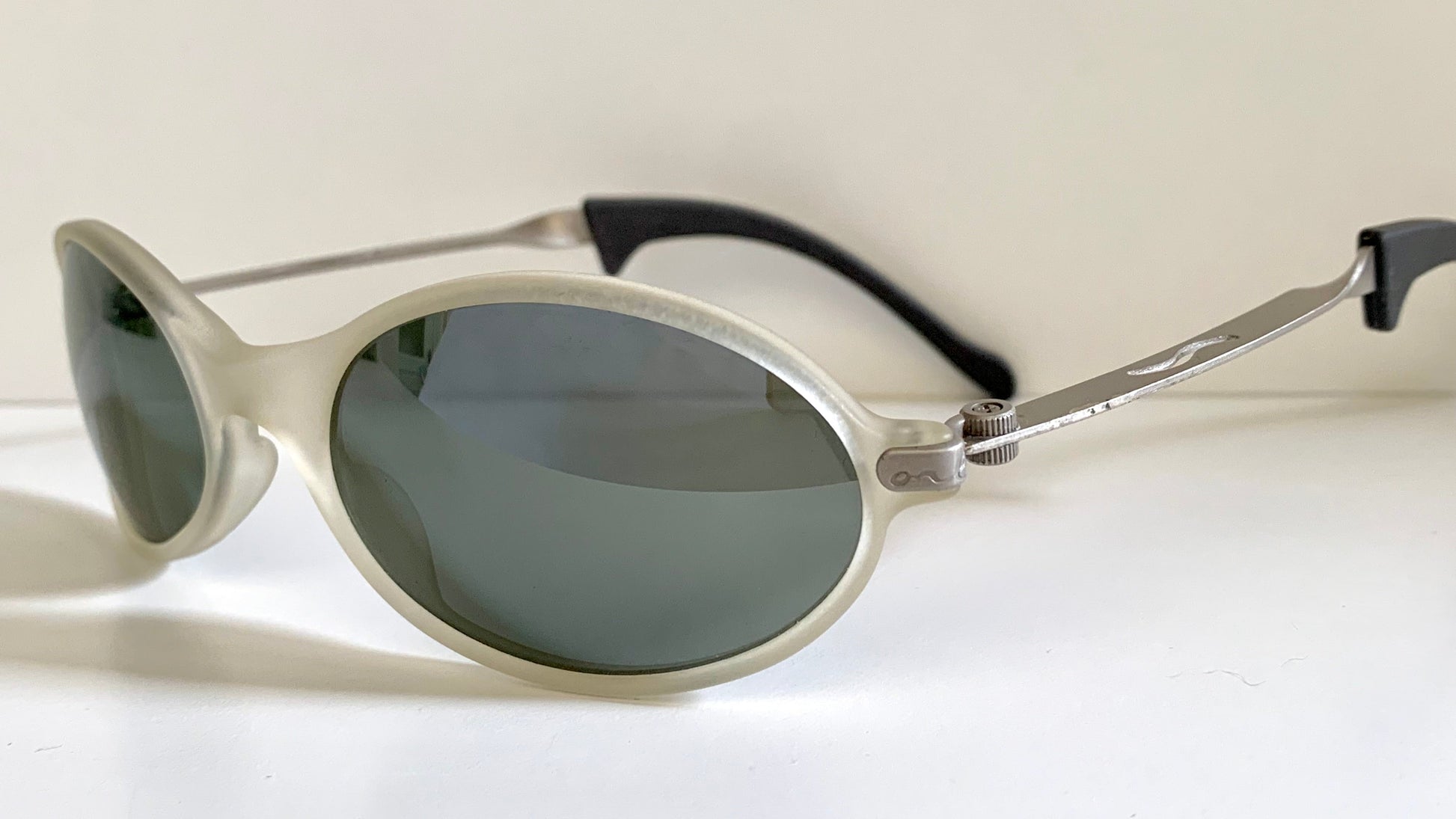 Ray Ban Orbs W2390 clear and silver sunglasses on a white background