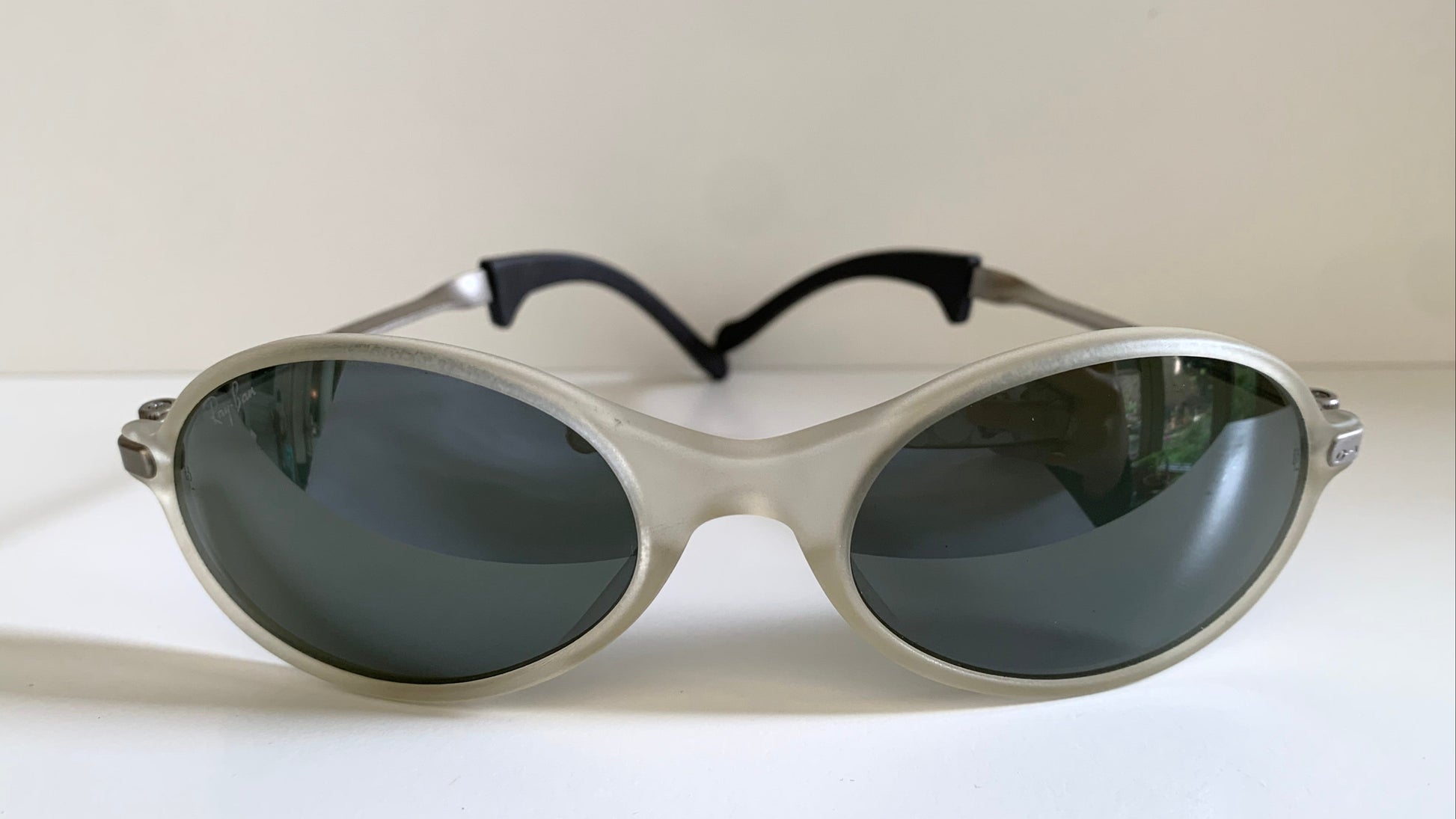 Ray Ban Orbs W2390 clear and silver sunglasses on a white background