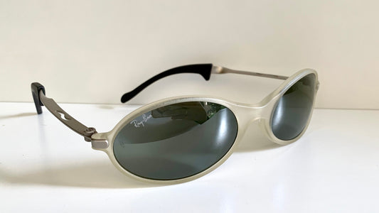 Ray Ban Orbs W2390 clear and silver sunglasses on a white background