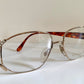 Eyeglasses with a tortoiseshell frame on a white surface