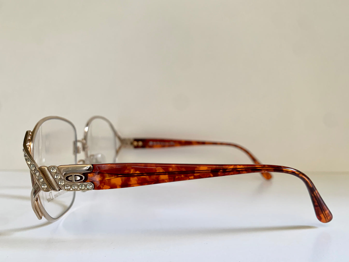 Tortoiseshell eyeglasses with decorative frame on a white background
