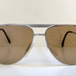 Aviator sunglasses with brown lenses on a white background
