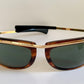 Sunglasses with tortoiseshell frame and dark lenses on a white background